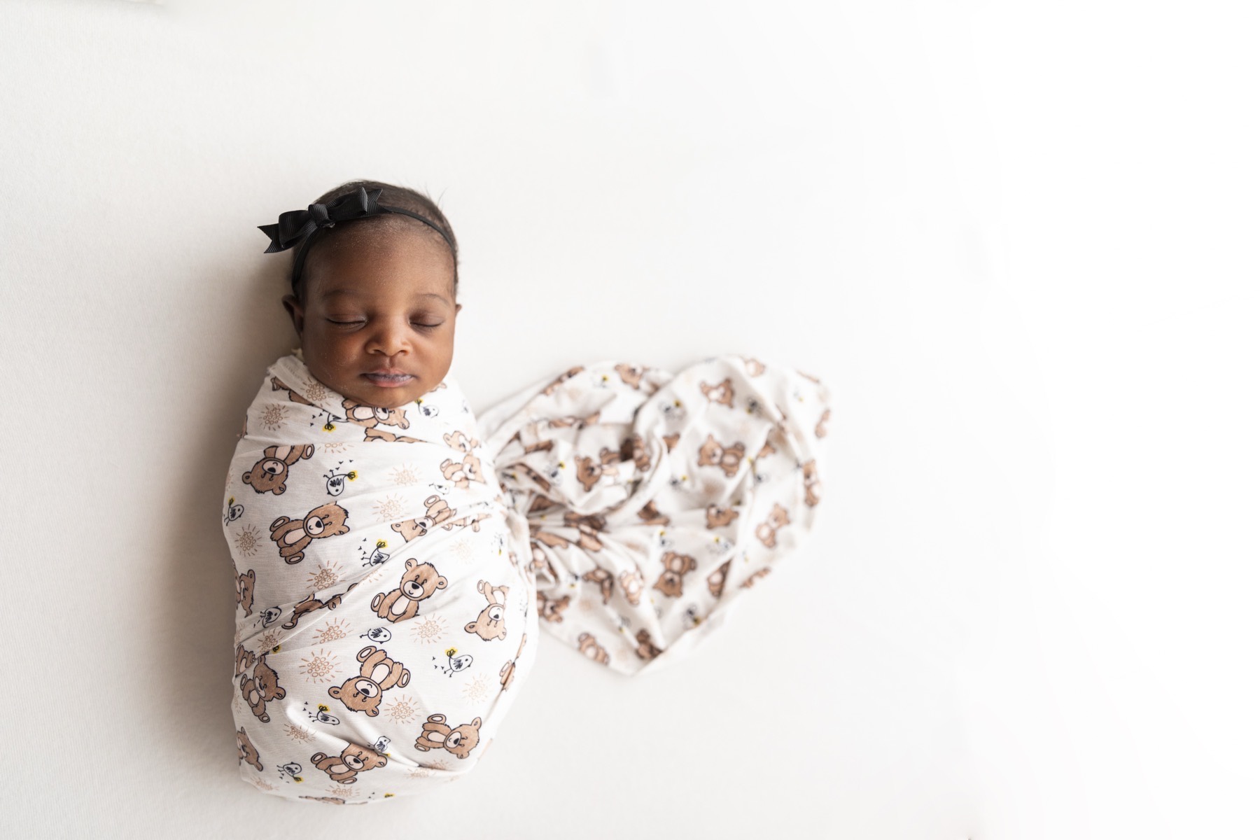 Baby sleeping in light swaddle